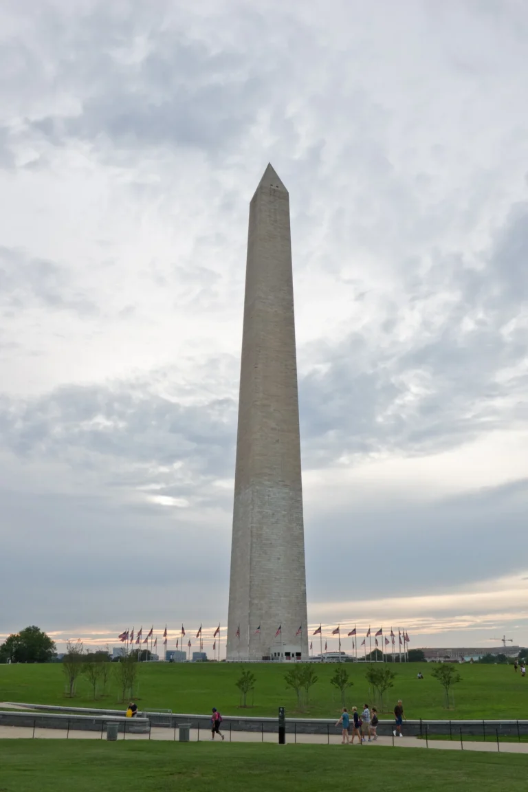 Family walking on the National Mall with the Washington Monument in Washington DC