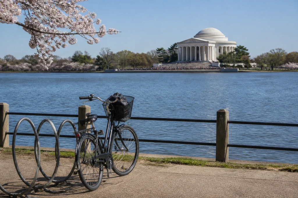 Jefferson Memorial seen across the Tidal Basin with a bicycle parked at a rack