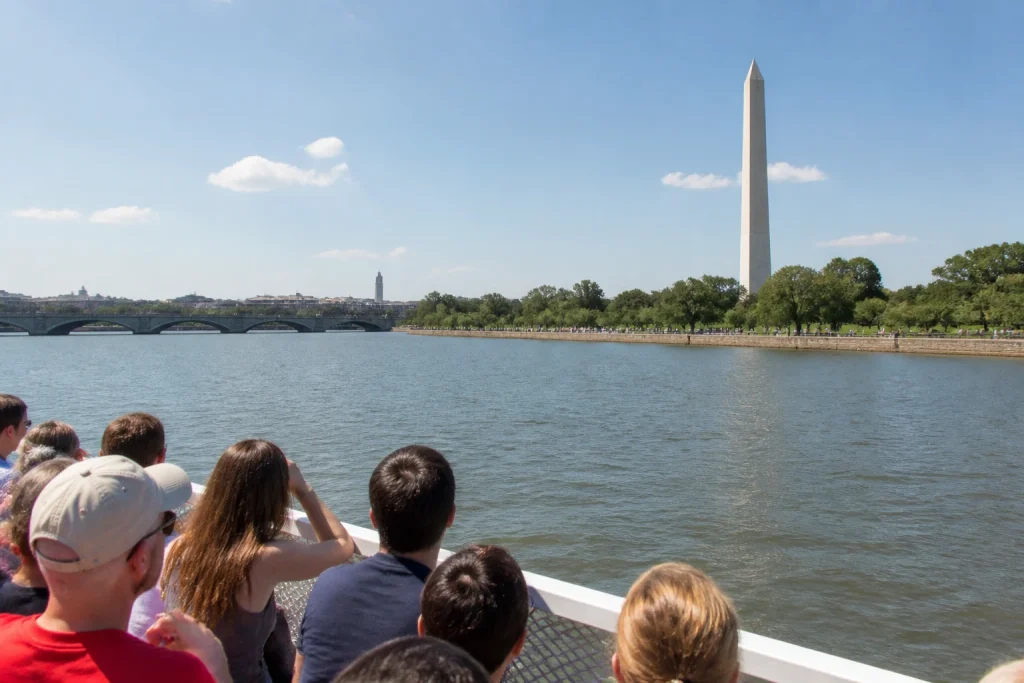 Passengers viewing Washington DC from a Potomac sightseeing cruise