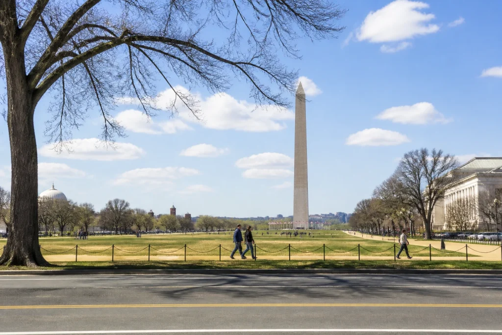 Street-level view of the National Mall and Washington Monument in Washington DC.
